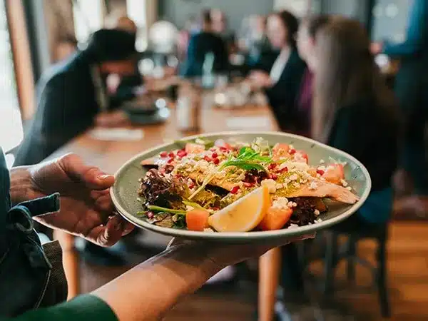 Restaurants Langebaan – Langebaan Business Directory – Langebaan Business Directory Langebaan business directory langebaan business directory a waiter carries a plate of food to waiting customers at a table at restaurants in langebaan